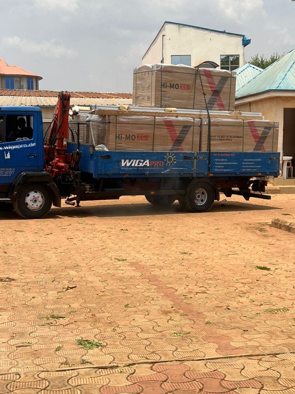 Truck carrying solar panels to an installation
